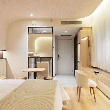 Qoya Hotel Curitiba, Curio Collection By Hilton Exterior foto A room at the hotel