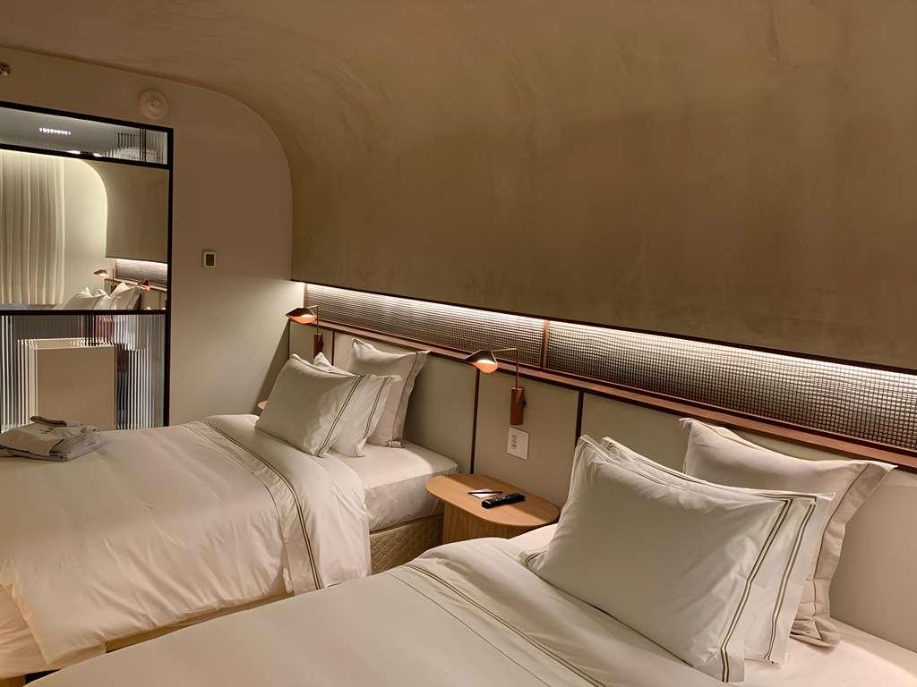 Qoya Hotel Curitiba, Curio Collection By Hilton Quarto foto A room at the hotel